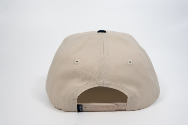 Revolt Snapback | Natural/Navy